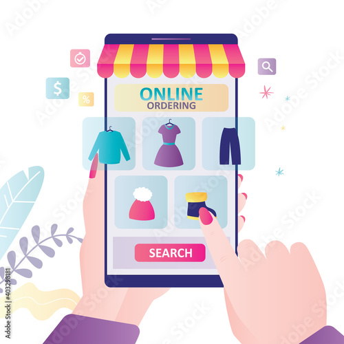 Hand holds smartphone with clothing store on screen. Woman chooses clothes in online mass market