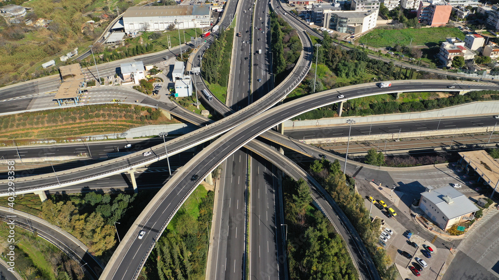 Aerial drone photo of modern Attiki Odos toll road interchange with National road in Attica, Athens, Greece Aerial drone photo of modern Attiki Odos toll road interchange with National road in Attica, Athens, Greece