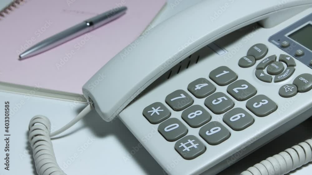 The man ended the call on the wired phone and hung up. The man ended the call on the wired phone and hung up.