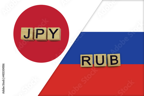 Japan and Russia currencies codes on national flags background © andreyakaan147