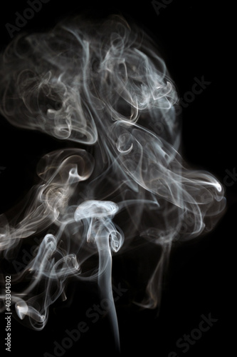 Abstract shape smoke in motion on a black background