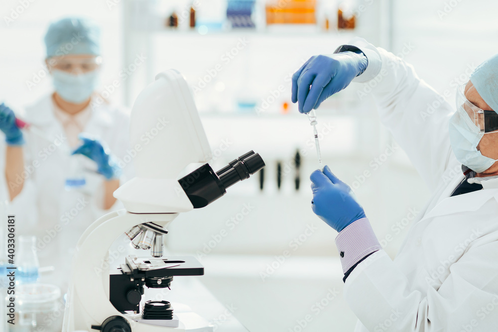 close up. scientist microbiologist working in the laboratory. close up. scientist microbiologist working in the laboratory.