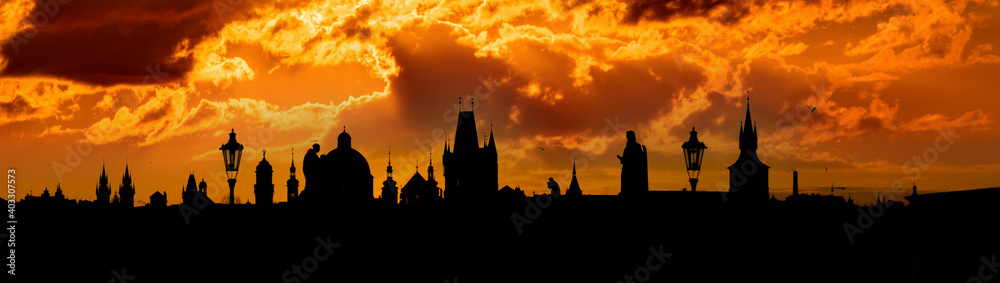 Wide angle view of silhouette of the old town of Prague's skyline at sunrise