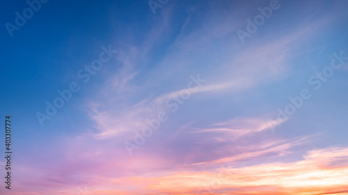 Beautiful colorful bright sunset sky with orange clouds. Nature sky background.