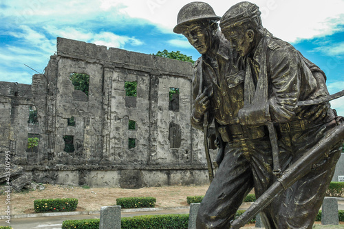 Commemorative statue with war ruins in background on the Island of Corregidor, Philippine, World War 2_04042007_0168. photo