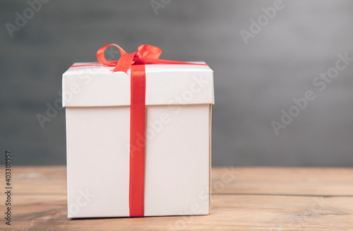 white gift box on wooden table