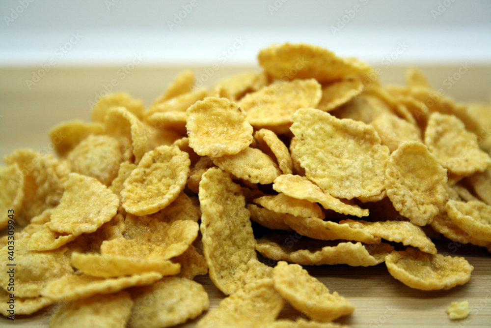 Cornflakes on a wooden background.