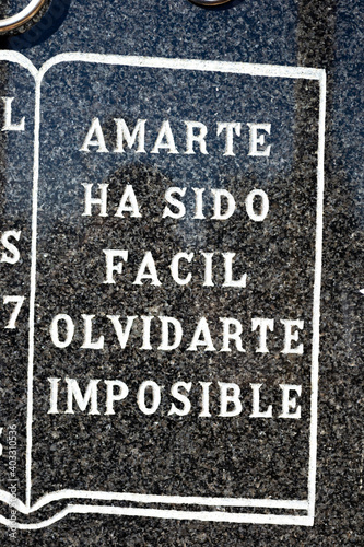 Spanish phrases to bless and remember the lost loved ones like dead family and friends placed on a tombstone in a grevyard located at llucmajor mallorca island balearic spain on a clear sunny day