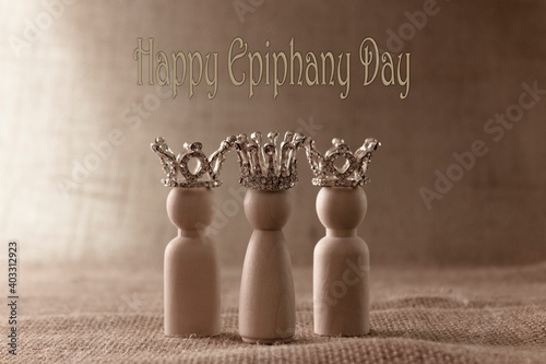 Canvas-taulu Three wise men figures with crowns on biege background and the text Happy Epiphany day