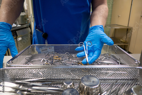 in a sterilization department in an operating room, instruments are sorted and cleaned