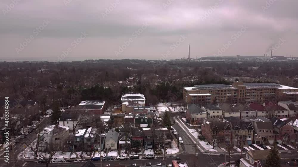 An aerial drone shot rising over the Upper Beaches neighbourhood of Toronto in winter. An aerial drone shot rising over the Upper Beaches neighbourhood of Toronto in winter.