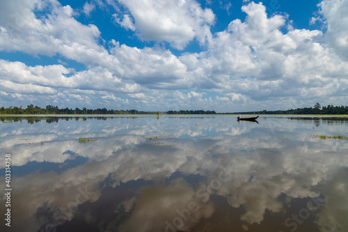 Local fisherman, in the lake surrounding the Buddhist Neak Pean temple, in the archaeological complex of Angkor, near the city of Siem Reap, Cambodia.