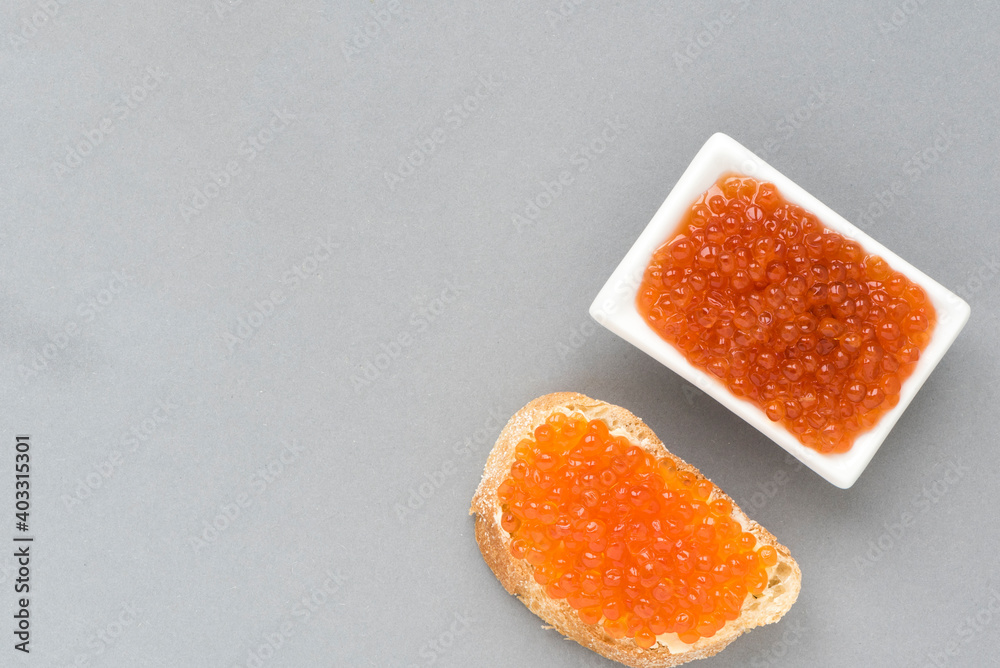 Sandwich with salted red caviar. Flat appetizer for Russian appetizer