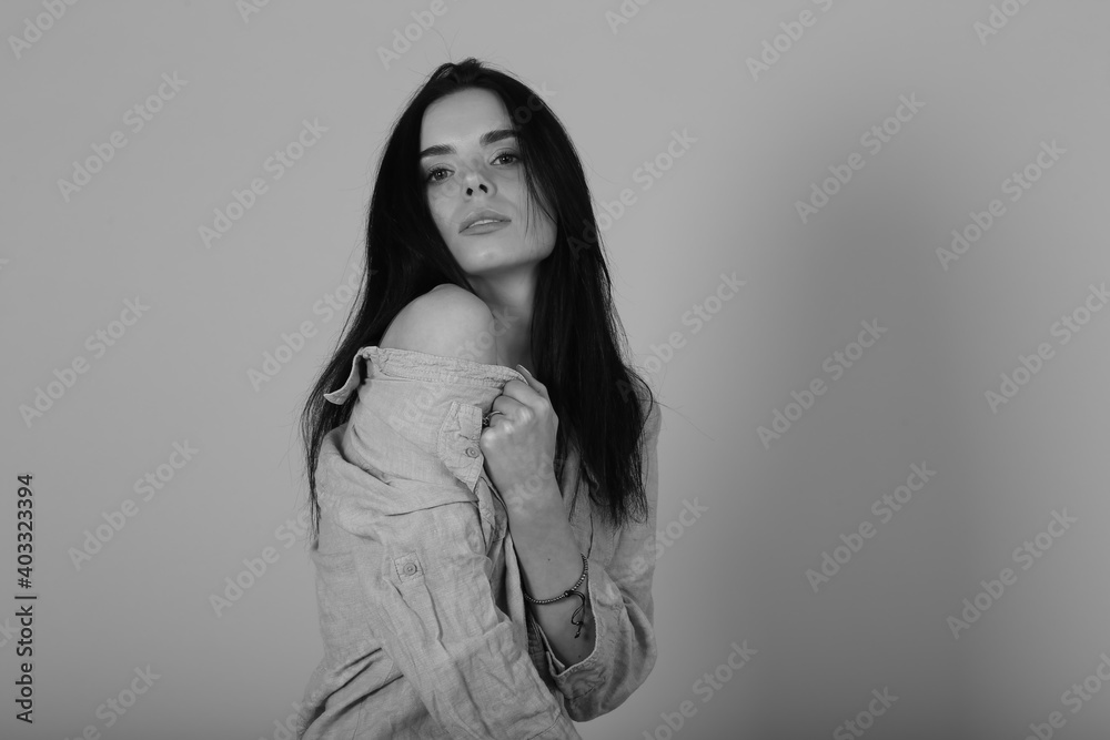 Black and white studio portrait of beautiful young brunette woman Black and white studio portrait of beautiful young brunette woman
