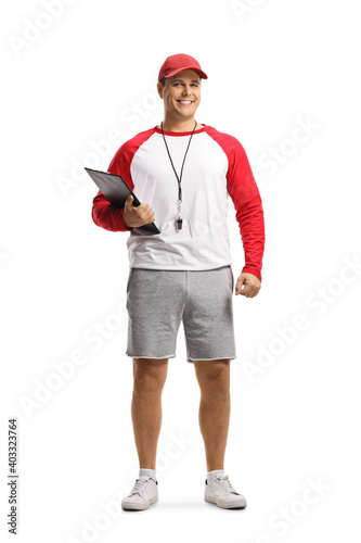 Photography Full length portrait of a baseball coach holding a clipboard