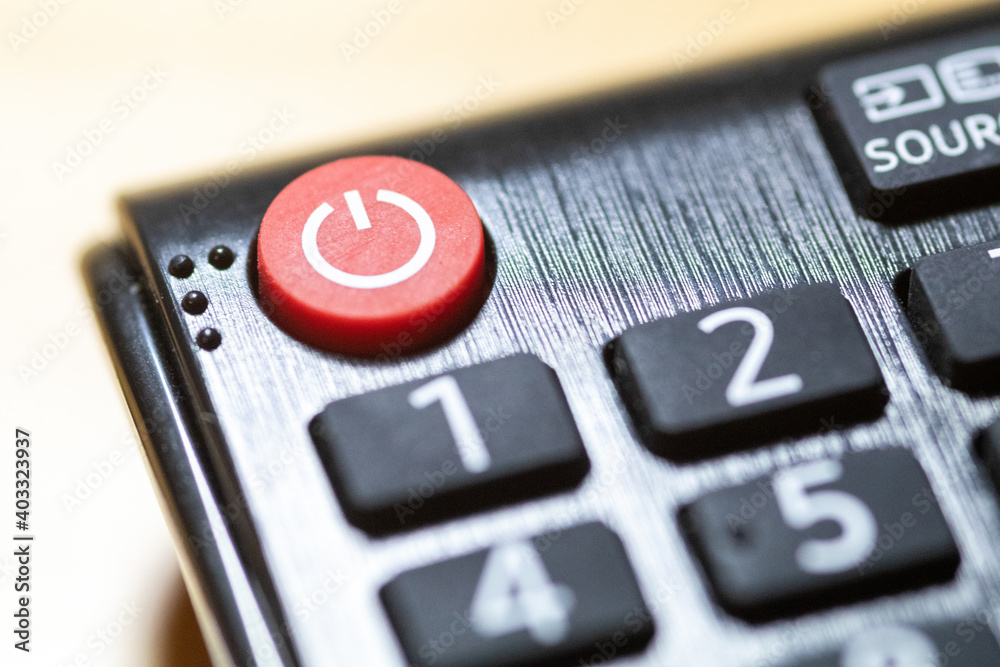 Button close-up on TV remote control with braille Button close-up on TV remote control with braille