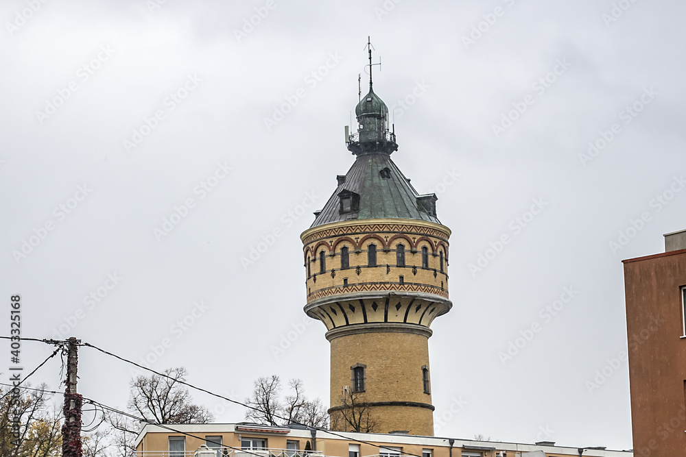 Obraz premium Wilhelminian water tower in Selestat. In 1887 genesis of Selestat drinking water network. Water tower is still in operation today. Place du General de Gaulle, Selestat, Alsace, France, Europe.