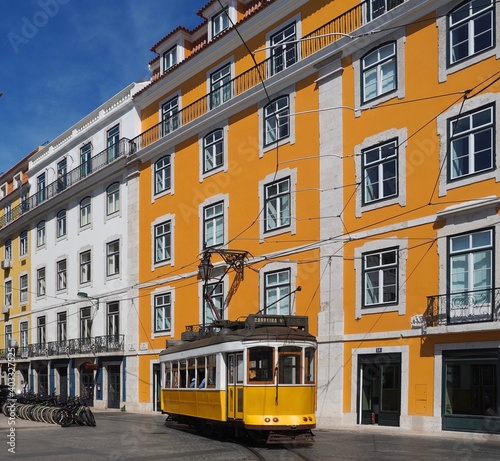 Colorful houses build the cityscape of Lisbon in Portugal with a traml