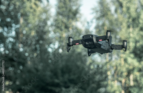 Flying drone with camera in the air shoots video