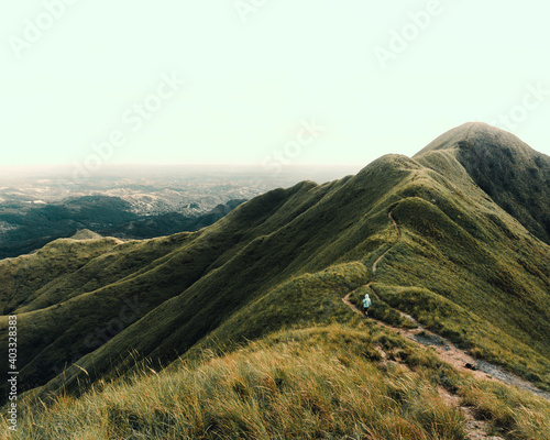 person walking by the mountain photo