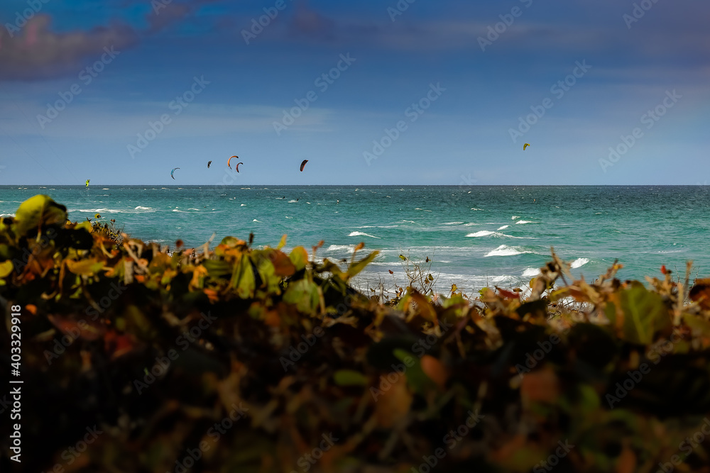 Kite surfing on a windy day offshore in Juno Beach Florida.