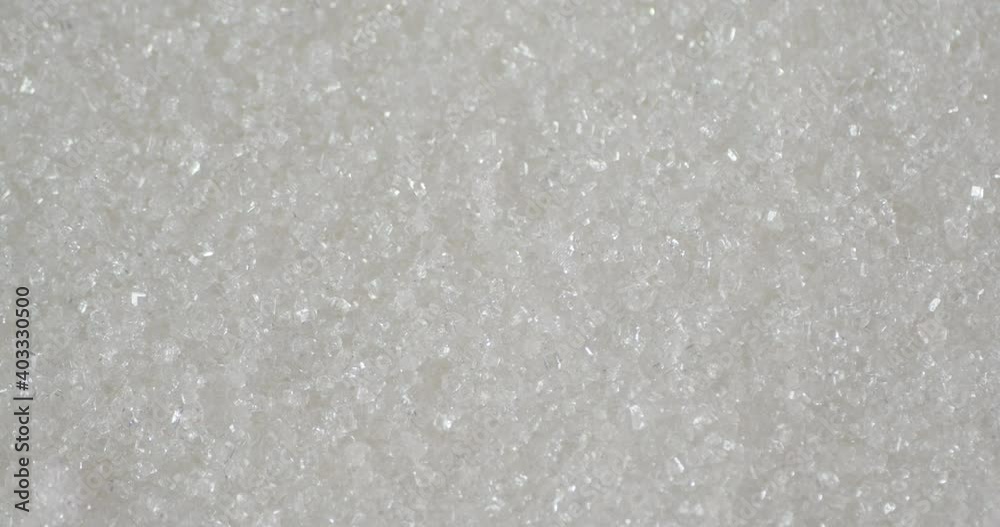 Sugar rotating slowly. Macro background. Sugar texture. Sugar rotating slowly. Macro background. Sugar texture.