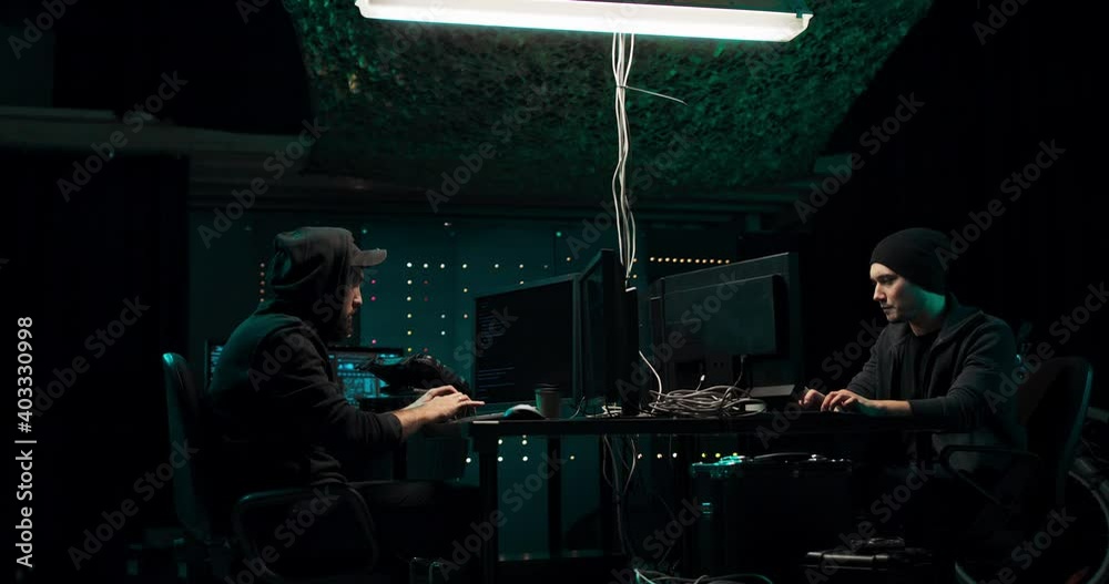 Two hackers break into the banking system and steal customer data. The guys are happy with the success and give them a high five. Screemers work in a secret hideout in the center of a large city. Two hackers break into the banking system and steal customer data. The guys are happy with the success and give them a high five. Screemers work in a secret hideout in the center of a large city.