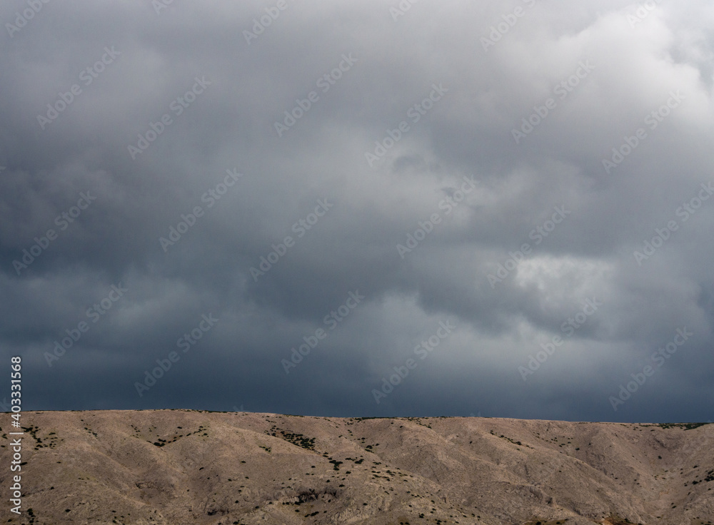 Dark clouds over the mountains.