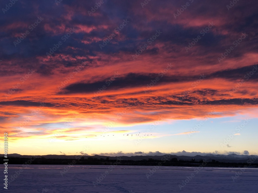 Beautiful sunset over the frozen lake