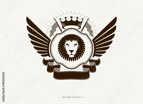 Heraldic coat of arms made in retro design, decorative emblem with wings, wild lion illustration and imperial crown