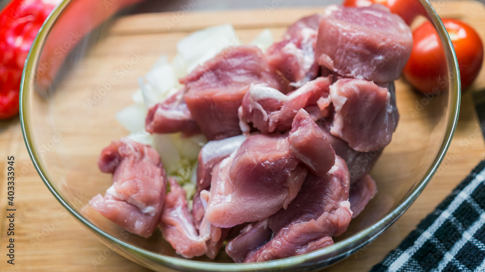 Top view of raw Pork tenderloin on glass bowl, Fresh raw meat prepared for cooking Top view of raw Pork tenderloin on glass bowl, Fresh raw meat prepared for cooking