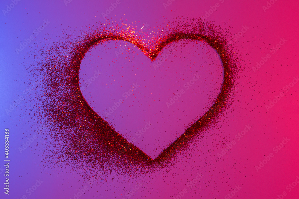 Happy Valentine's Day. Heart of red bright sparkles and glitter in pink-blue neon lights.Artistic design colorful and shiny bright background