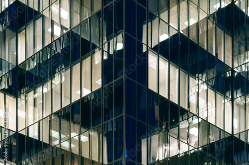 Canvas Print Office lights reflect in the corner of a skyscraper