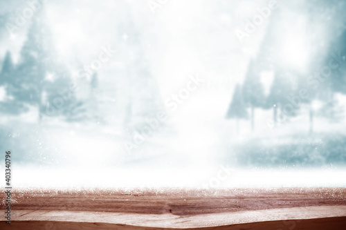 Empty wood table with backdrop blurred winter forest Bokeh background  Can be used for display your product.