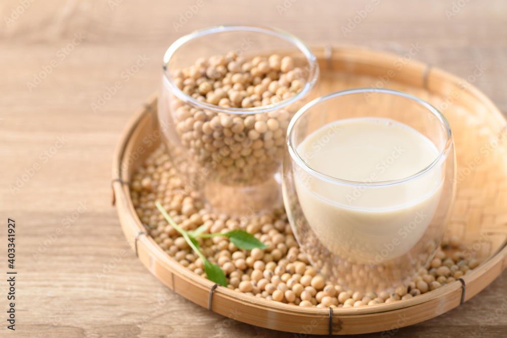 Soy milk and soy beans in a glass on bamboo tray, Healthy drink Soy milk and soy beans in a glass on bamboo tray, Healthy drink
