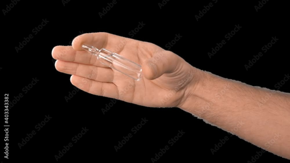 Alpha channel. Male hands presenting a syringe in their hands fill it with medicine or a vaccine taking it from a glass flask for use in the treatment of diseases