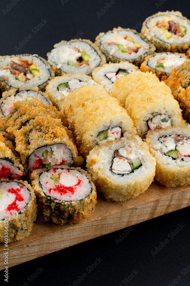 Close up macro shot of crispy fried rolls with crab, shrimp and caviar, advertisement shot Close up macro shot of crispy fried rolls with crab, shrimp and caviar, advertisement shot
