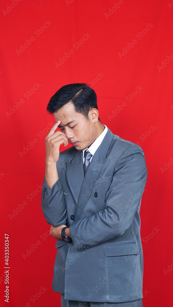 Business asian man thinking and get some ideas isolated red background Business asian man thinking and get some ideas isolated red background