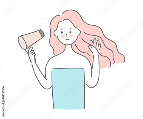 .Woman drying hair with a hair dryer