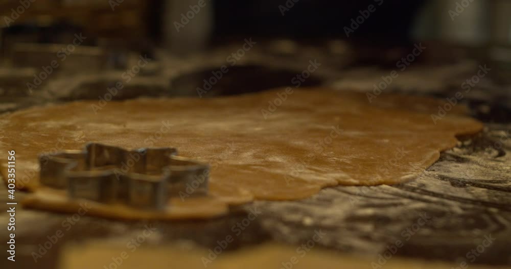 Cutting gingerbread dough with different cutting forms. Close up, slow motion Cutting gingerbread dough with different cutting forms. Close up, slow motion