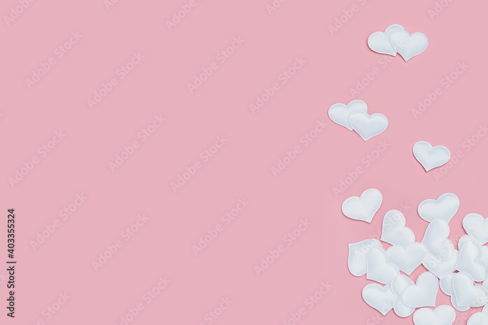 Valentines Day background with white hearts on pink colored. Greeting card or invitation for wedding cards. Pastel colors.