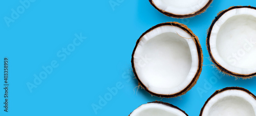 Coconuts on blue background. Top View