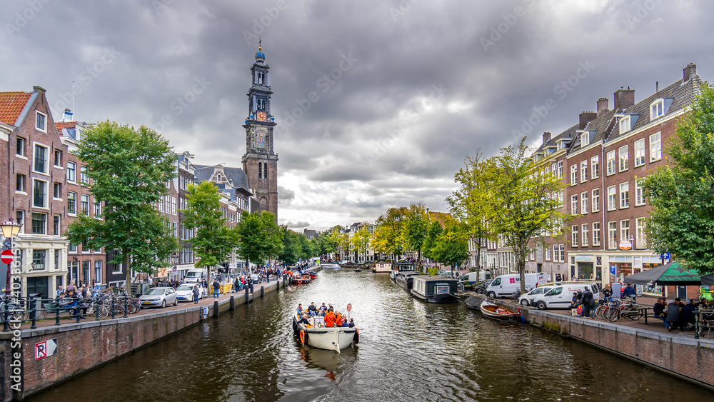 Westertoren tower seen from the intersection of the Leliegracht and Prinsengracht canals in the Jordaan neighborhood