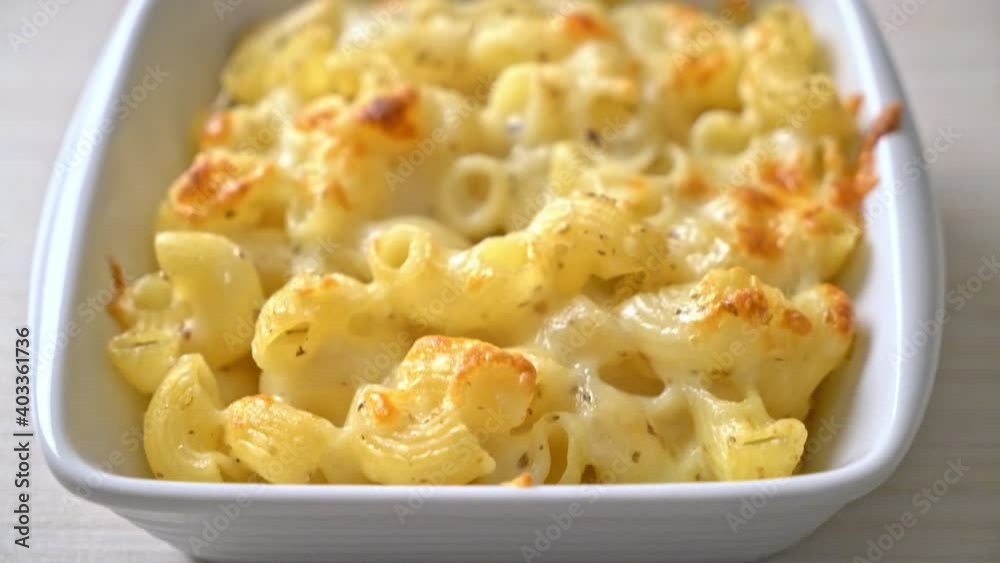 mac and cheese, macaroni pasta in cheesy sauce - American style mac and cheese, macaroni pasta in cheesy sauce - American style