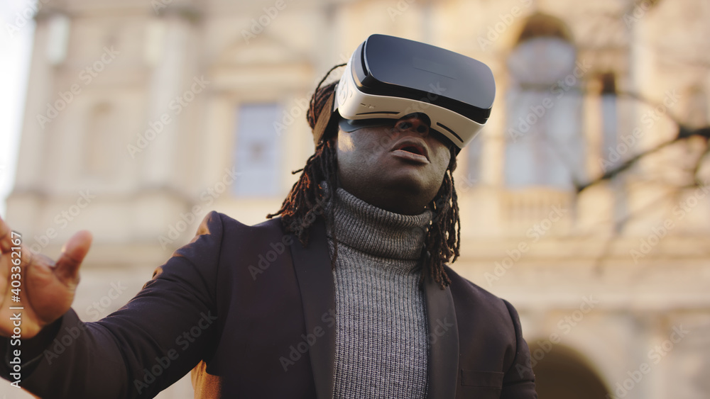 African american black man wearing VR headset outside. High quality photo African american black man wearing VR headset outside. High quality photo