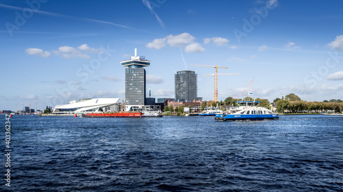 Photography The harbor named Het IJ with the futuristic building shape of the Eye Film Museu