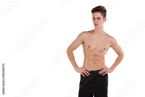 Young attractive shirtless student. White background.