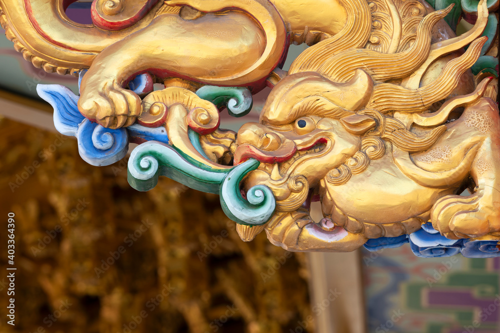 Fototapeta premium Dragon statue at the ancient Chinese temple in Thailand