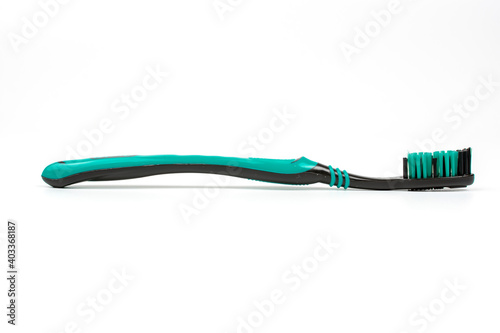 toothbrush black with blue on a white background