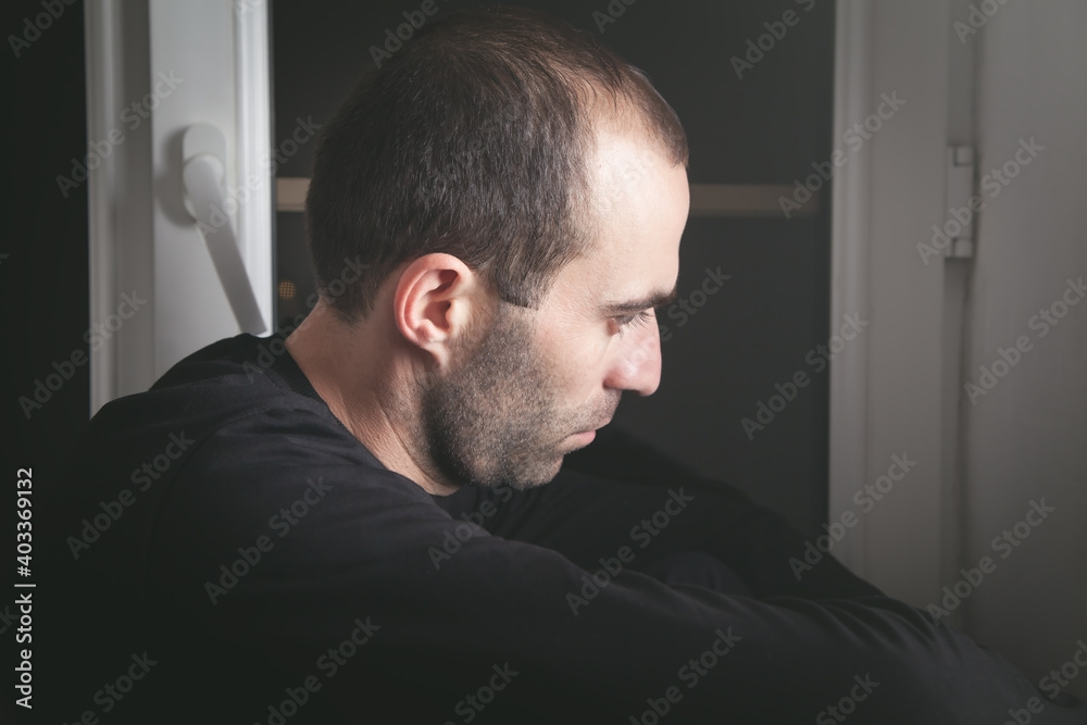 Fototapeta premium Caucasian sad and depressed man at home.